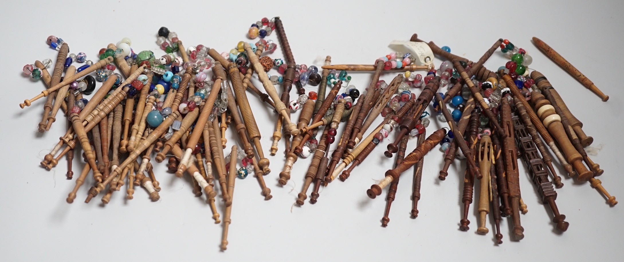 Fifty 19th century finely turned wooden lace bobbins with beaded ends together with 35 ornate wooden bobbins with beaded ends and 5 plain wooden bobbins unleaded (90)
